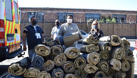 City and Design Indaba hand over Shelter bags to the homeless 